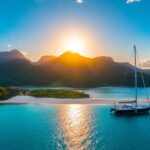 Vibrant sunset over the Austral Islands with sailboat.