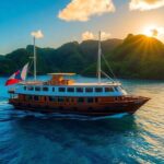 Tuhaa Pae freighter on turquoise waters at sunset.