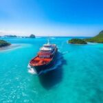 Tuhaa Pae freighter cruising in stunning turquoise waters.