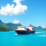 Freighter sailing through turquoise South Pacific waters.